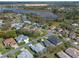 Extensive aerial view showcases homes in a well-planned neighborhood with lake views and green spaces at 5533 Squires Dr, Leesburg, FL 34748