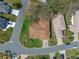 A top-down view showing a single-story home with a well-maintained landscape and clean roof at 5533 Squires Dr, Leesburg, FL 34748