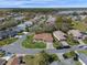 An aerial view showcases the single story home's well-kept lawns in a friendly neighborhood at 5533 Squires Dr, Leesburg, FL 34748