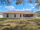 The home's exterior features a patio, well-maintained lawn, and landscaping, creating a serene outdoor setting at 5533 Squires Dr, Leesburg, FL 34748