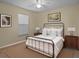 This staged bedroom includes a bed, side tables, and decorative elements that enhance its appeal at 5533 Squires Dr, Leesburg, FL 34748