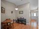 Cozy dining area with hardwood floors and a view of the front entrance at 5533 Squires Dr, Leesburg, FL 34748