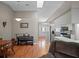 Bright dining area featuring hardwood floors, natural light, and open access to the kitchen at 5533 Squires Dr, Leesburg, FL 34748