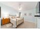 Bedroom with pale blue walls, carpeted floors, a ceiling fan, and natural light at 589 Society Hill Cir, The Villages, FL 32162