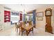 Cozy dining room featuring a grandfather clock and built in window seating at 589 Society Hill Cir, The Villages, FL 32162