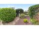 Charming garden path with an arbor and lush greenery at 589 Society Hill Cir, The Villages, FL 32162