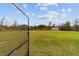 Picture of the spacious, fenced-in backyard with a storage shed, as seen from the screened-in porch at 5890 Sw 167Th Pl, Ocala, FL 34473