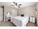 Bedroom with a white bed, a ceiling fan, and white furniture at 5890 Sw 167Th Pl, Ocala, FL 34473