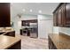 Spacious kitchen featuring stainless steel appliances, rich cabinetry, and ample counter space at 5890 Sw 167Th Pl, Ocala, FL 34473