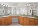 Primary bathroom boasts dual sinks, generous counter space, and separate vanity at 6035 Falconbridge Pl, Mount Dora, FL 32757
