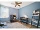 Bedroom with light blue walls, piano, desk, and couch at 6035 Falconbridge Pl, Mount Dora, FL 32757