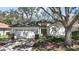 Charming single-story home features a well-manicured lawn, two-car garage, and neutral-colored stucco exterior at 6035 Falconbridge Pl, Mount Dora, FL 32757