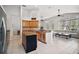 Well-designed kitchen featuring granite countertops, stainless steel appliances, and breakfast bar seating at 6035 Falconbridge Pl, Mount Dora, FL 32757
