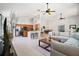 Open-concept living space seamlessly connects the living room, dining area, and kitchen at 6035 Falconbridge Pl, Mount Dora, FL 32757