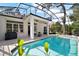 Backyard pool with a screened-in enclosure and plenty of seating area for entertaining at 6035 Falconbridge Pl, Mount Dora, FL 32757