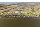 Wide aerial shot capturing the community's lakefront location, with private boat docks at 6342 Sailboat Ave, Tavares, FL 32778