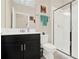 Clean bathroom featuring a walk-in shower, single sink vanity, and tiled flooring at 9040 Azalea Sands Ln, Davenport, FL 33896