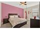 Bright bedroom features a ceiling fan, plush carpet, and a swing for a playful and cozy atmosphere at 9040 Azalea Sands Ln, Davenport, FL 33896