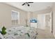 Bedroom featuring a bed, side table, and television stand with TV at 9040 Azalea Sands Ln, Davenport, FL 33896