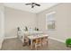 Bedroom featuring a bed, table, ceiling fan, and large window at 9040 Azalea Sands Ln, Davenport, FL 33896