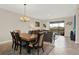 Inviting dining area adjacent to the living room and patio, perfect for entertaining guests at 9040 Azalea Sands Ln, Davenport, FL 33896