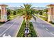 Grand entrance to Champions Gate with manicured landscaping, impressive signage, and a welcoming atmosphere at 9040 Azalea Sands Ln, Davenport, FL 33896