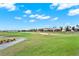 Scenic view of the lush golf course with meticulously maintained greens and fairways for a luxury lifestyle at 9040 Azalea Sands Ln, Davenport, FL 33896