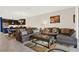 Comfortable living room showcasing tile floors, plush seating, and an inviting atmosphere at 9040 Azalea Sands Ln, Davenport, FL 33896