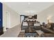 Spacious living room showcasing an open layout, tile flooring, and an open design to the kitchen at 9040 Azalea Sands Ln, Davenport, FL 33896