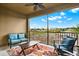 Relaxing screened-in patio with comfortable blue seating and a view of the golf course at 9040 Azalea Sands Ln, Davenport, FL 33896