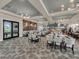 Elegant restaurant with stylish seating, modern lighting, and a chef's kitchen offering a fine dining experience at 9040 Azalea Sands Ln, Davenport, FL 33896