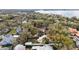 Aerial view of the neighborhood showcasing the home's location in a lush, tree-filled area at 932 N Mcdonald St, Mount Dora, FL 32757