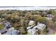 Aerial view of the property showcasing the house, detached garage, deck and landscaping at 932 N Mcdonald St, Mount Dora, FL 32757