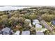 Aerial view of the neighborhood showcasing the home's location and mature trees at 932 N Mcdonald St, Mount Dora, FL 32757