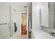 Bathroom featuring a glass-enclosed shower with white subway tile and a marble vanity at 932 N Mcdonald St, Mount Dora, FL 32757