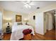 Relaxing bedroom with hardwood floors and neutral color palette at 932 N Mcdonald St, Mount Dora, FL 32757