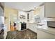 Well-lit kitchen with white cabinets, modern appliances, and decorative tiled flooring at 932 N Mcdonald St, Mount Dora, FL 32757