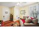 Well lit living room with hardwood floors and cozy seating area at 932 N Mcdonald St, Mount Dora, FL 32757