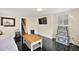 Inviting living room with dark floors and neutral walls at 932 N Mcdonald St, Mount Dora, FL 32757