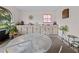 Bright sunroom with white cabinets, a sink, and large windows to let in plenty of natural light at 9829 Wedgewood Ln, Leesburg, FL 34788