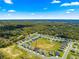 Aerial view of the home in a suburban community surrounded by green spaces at 10420 E 161St St, Summerfield, FL 34491