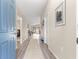 Inviting foyer with wood-look floors that leads to the living area, offering a seamless transition and welcoming atmosphere at 10420 E 161St St, Summerfield, FL 34491