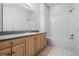 Bathroom featuring vanity with cabinets, tile flooring, and shower at 10944 Autumn Ln, Clermont, FL 34711