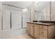 Bathroom featuring vanity with cabinets, frosted glass shower and tile flooring at 10944 Autumn Ln, Clermont, FL 34711