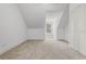 Bright bedroom featuring neutral carpet, white walls, and a sunlit window at 10944 Autumn Ln, Clermont, FL 34711