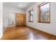 Bright bedroom with hardwood floors, natural wood trim, and lots of natural light at 10944 Autumn Ln, Clermont, FL 34711