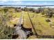 Gated entrance with a long driveway leading to the home and lake at 10944 Autumn Ln, Clermont, FL 34711