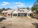 Spacious home exterior featuring a sunroom and brick accents at 10944 Autumn Ln, Clermont, FL 34711