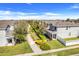 Beautiful aerial view of a two-story home with lush landscaping and a charming front porch at 11090 Silver Surfer Aly, Winter Garden, FL 34787