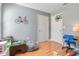 Playful room with bicycle decor and light hardwood floors at 11090 Silver Surfer Aly, Winter Garden, FL 34787